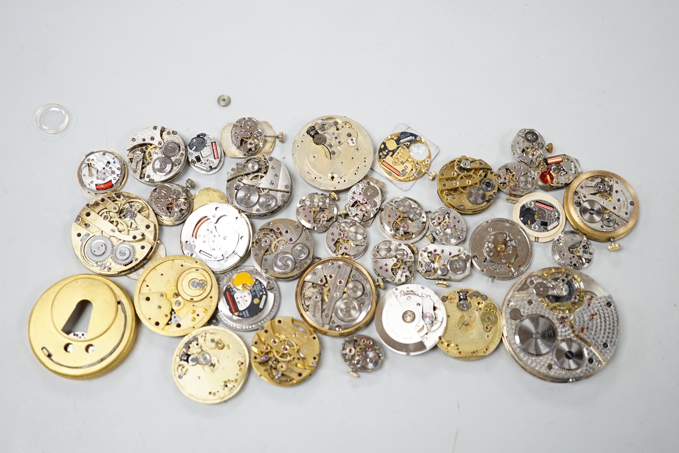 A quantity of assorted wrist and pocket watch parts and movements.